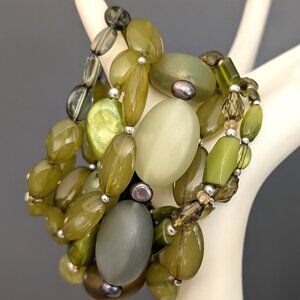 Bundle of shades of green with gray and yellow accents stretch bracelets